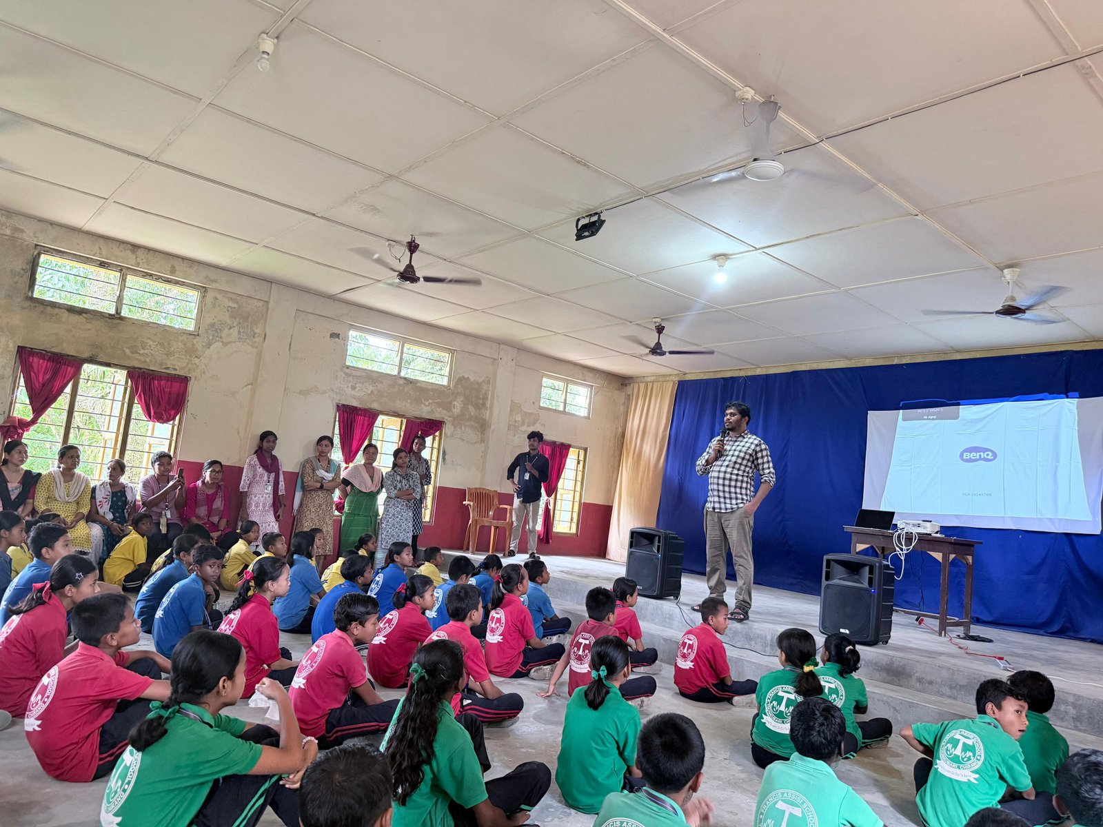 Children learning from Principal